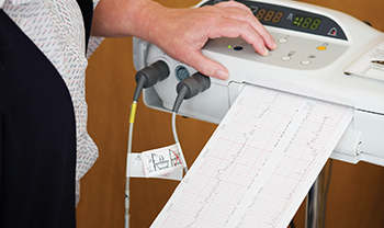EKG machine with report printing out