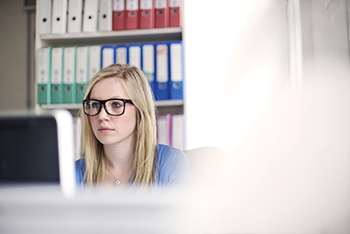 Woman sitting in front of computer